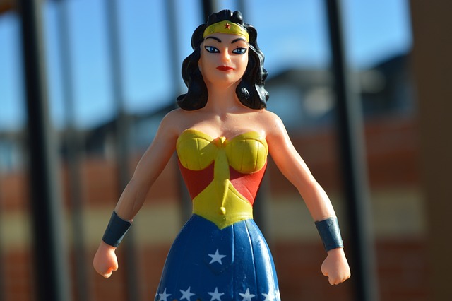 photograph of wonder woman figurine standing in a powerful pose